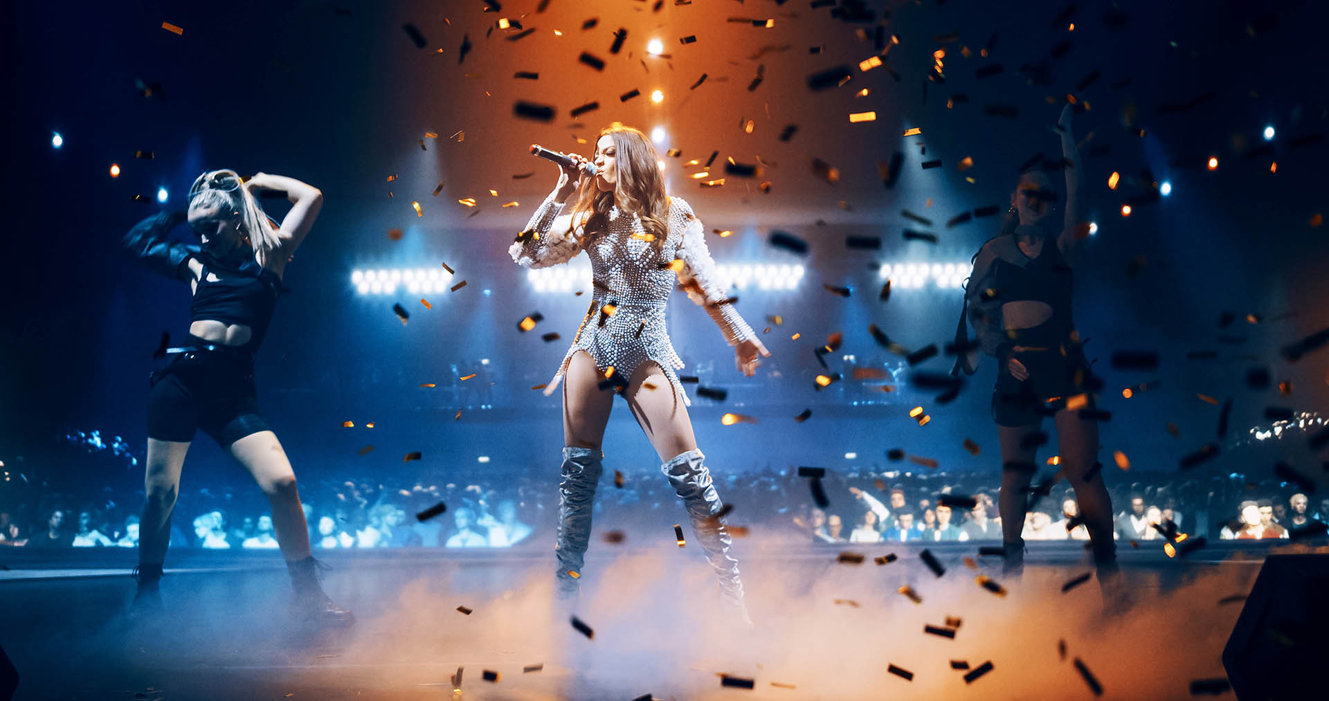 Portrait of Two Beautiful Female Pop Singers Performing on Stage